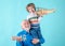 Old grandfather and young child grandson piggyback with toy plane and wooden truck. Men generation granddad and