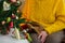 Old grandmother in new year. senior lady. granny in yellow knitted soft sweater. elderly woman at decorated christmas