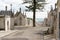 Old graves in Alto de Sao Joao cemetery, with harbor of Lisbon and Tagus riverin the distance