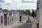 Old graves in Alto de Sao Joao cemetery, with harbor of Lisbon and Tagus riverin the distance