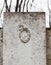 Old gravestone with damaged portrait of the buried person