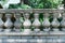 Old gray balustrade with stone columns and railing