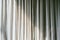 Old gray canvas curtains with sunlight and shadow shading on. Home decoration in minimal style