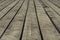 Old gray floorboards with gaps, closeup, background, texture