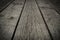 Old gray floorboards with gaps, closeup, background, texture