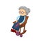 Old gray-haired grandmother, sits in cozy chair rocking, embroidering, knitting.