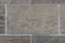 Old gray wall of large concrete blocks. Closeup. Gray wall grungy surface texture. Horizontal background for interior