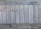 Old gray weathered knotted wooden wall