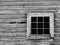 Old gray wood wall with window background.