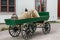 Old green colored horse carriage with wheels made of wood