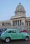 Old Green Cuban classic vintage yank tank car in front of National Capitol Building, Havana, Cuba
