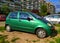 Old green Daewoo Matiz private compact car four doors parked