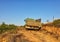 Old Green Dump Truck on Dirt Road