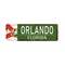 Old green grunge Orlando road sign on a white background