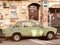 An old green Lada sits in the sun on the streets of Kyiv - UKRAINE - KYIV