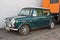 Old green Morris Mini Cooper parked