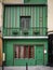 Old green and red building in Paris, France