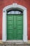 Old green wooden doors in a stone portal in Meissen, Germany