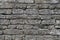 Old grey color grungy brick wall texture