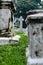 Old grey tombstones. Cemetery in Malaysia