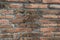 Old grudge red brick wall texture background.