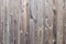 Old grunge dark brown wood panel pattern with beautiful abstract grain surface texture, vertical striped background or backdrop in