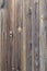 Old grunge dark brown wood panel pattern with beautiful abstract grain surface texture, vertical striped background or backdrop i