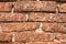 Old grunge laterite brick wall texture for background