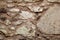 Old grunge stone wall texture, material, pattern wallpaper and background, close up. Natural contrast masonry rock wall granite.