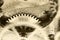 Old grunge texture of steel gears. Macro. Sepia