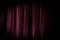 Old grunge theater purple curtain background.