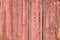 Old grunge and weathered light red wooden wall planks texture