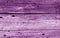 Old grunge wooden fence pattern in purple color