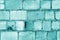 Old grungy brick wall surface in cyan color