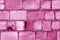 Old grungy brick wall surface in pink color