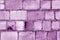 Old grungy brick wall surface in purple color