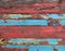 Old grungy multicolor wood planks background texture.