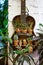 Old guitar with cacti collection inside. Creative interior decoration.