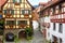 Old half-timbered houses in South Germany. Beautiful typical houses in German village. Vintage narrow street in summer