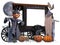 Old halloween shop on black wooden wheels with white advertising sign