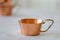 Old hammered copper bowl on white background