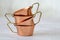 Old hammered copper bowl on white background