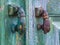 Old hand shaped metal door handles in Obidos, Portugal