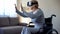 Old handicapped woman enjoying virtual reality in headset, modern technologies