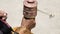 Old hands of a Tibetan woman holding prayer buddhist wheel at a Hemis monastery, Leh district, Ladakh, Jammu and Kashmir, north In