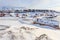 Old harbor and Nuuk city center covered in snow