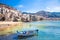 Old harbor with wooden fishing boat in Cefalu, Sicily