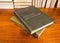 Old hardback english dictionary in two volumes on wooden table