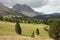 Old hayloft in a pasture in Val di Funes at fall Dolomites - Odle group in the background