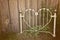 Old heart-shaped white wrought iron headboard